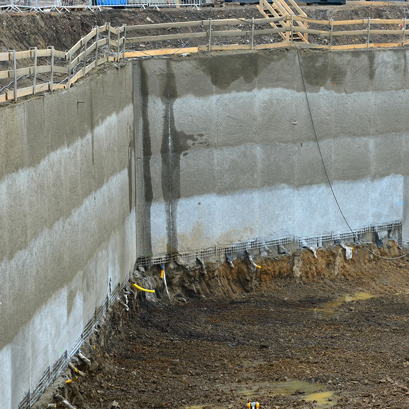 retaining wall with concrete grouting and drainage